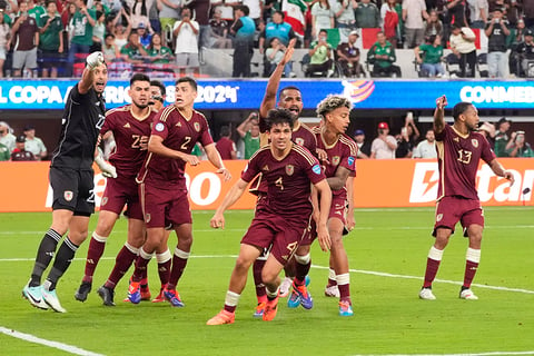 Venezuela players react after Mexico's Orbelin Pineda misses a penalty